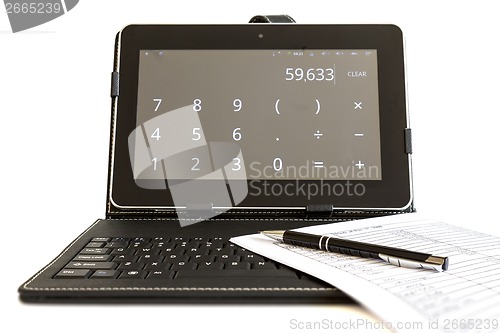 Image of Calculating on digital tablet computer