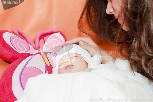 Image of young mother with new born baby.