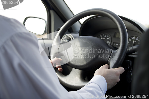 Image of Man driving car