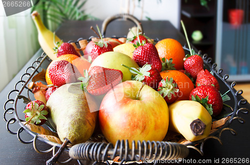 Image of fruits basket in living room