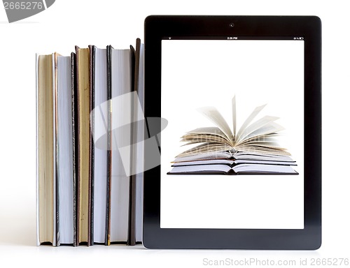 Image of Opened books on digital tablet concept