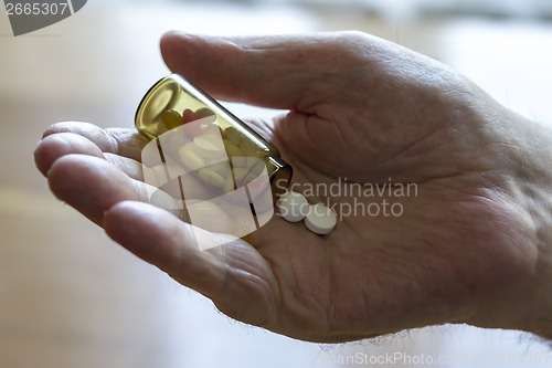 Image of  holding pills