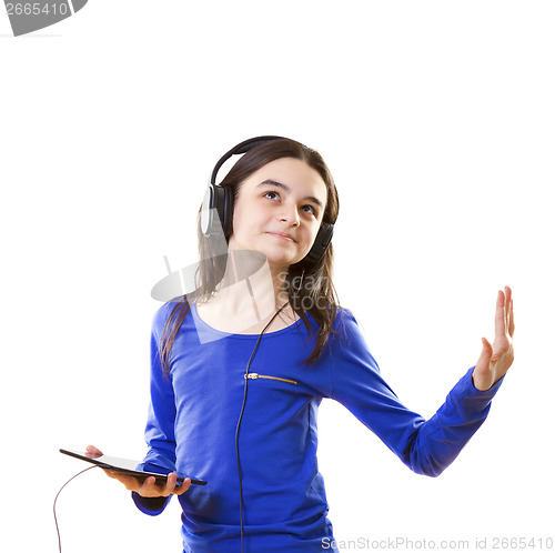 Image of Smiling girl listening to music