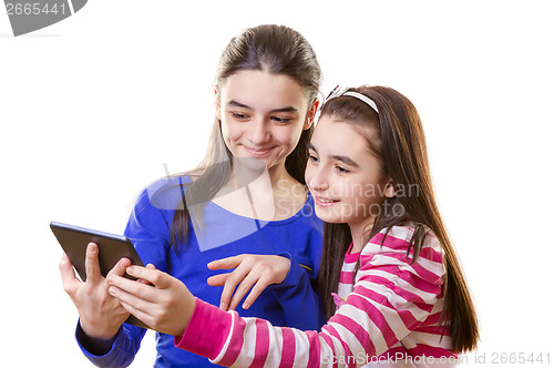 Image of Happy teen girls with digital tablet 