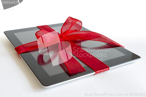 Image of Digital tablet with christmas present