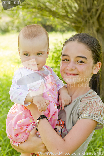 Image of teenage girl with a baby girl