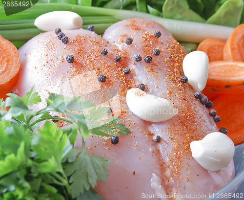 Image of Raw chicken breast with vegetables