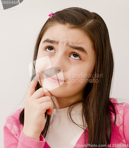 Image of Little girl thinking