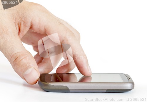 Image of Finger touching smart phone