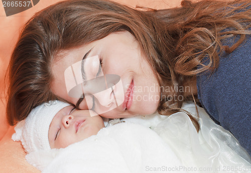 Image of  young mother with new born baby.