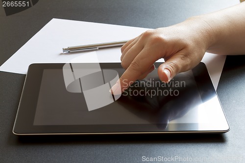 Image of Finger Pointing on Digital Tablet.