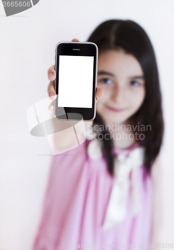 Image of Little girl with modern touch white screen phone