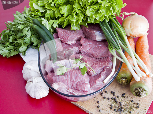 Image of raw beef with vegetables