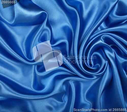 Image of Smooth elegant blue silk as background 