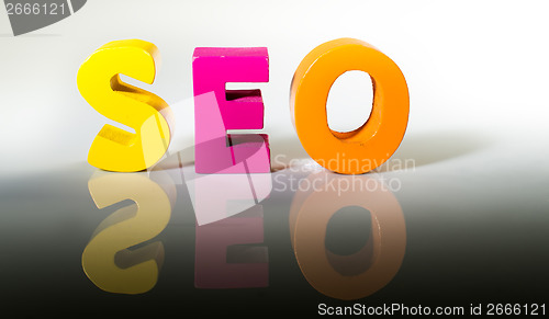 Image of Multicolored word seo made of wood.
