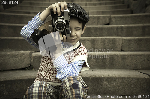 Image of Child with vintage camera