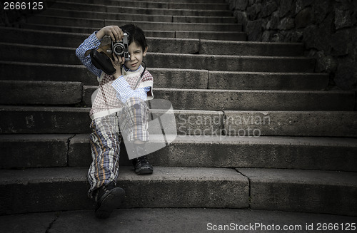 Image of Child with vintage camera