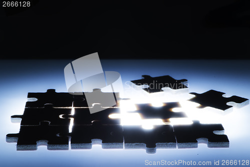 Image of Wooden puzzle and backlight background