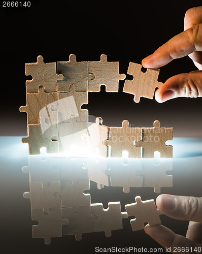 Image of Wooden puzzle and backlight background. Close up