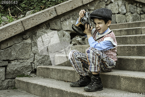 Image of Child with vintage camera