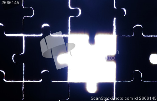 Image of Wooden puzzle and backlight background