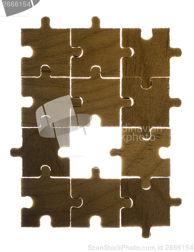 Image of Wooden puzzle and backlight background