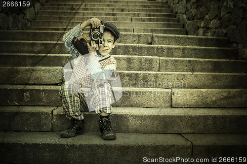 Image of Child with vintage camera