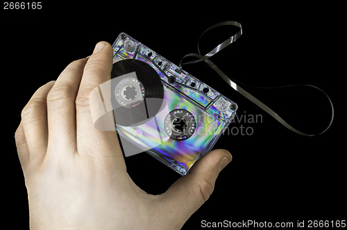 Image of Hand holding vintage cassette tape