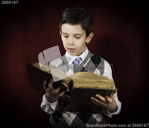 Image of Child with red vintage book