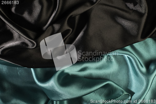 Image of Shiny black and green satin fabric