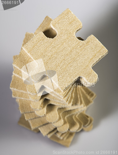 Image of Wooden puzzle on white background. 