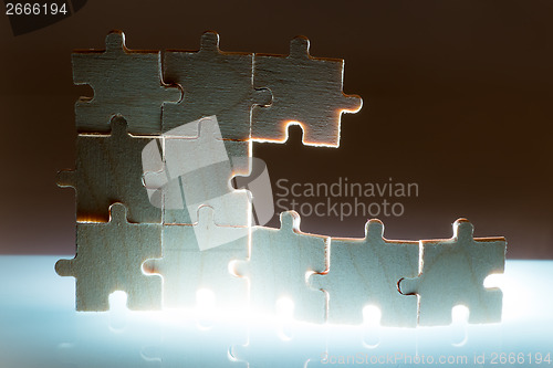 Image of Wooden puzzle and backlight background. Close up
