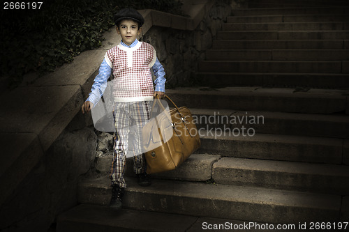 Image of Exterior stairs and child with vintage bag