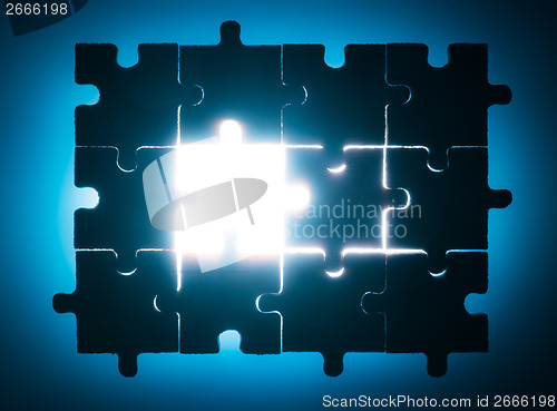 Image of Wooden puzzle and backlight background