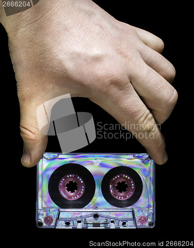 Image of Hand holding vintage cassette tape