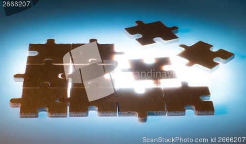 Image of Wooden puzzle and backlight background