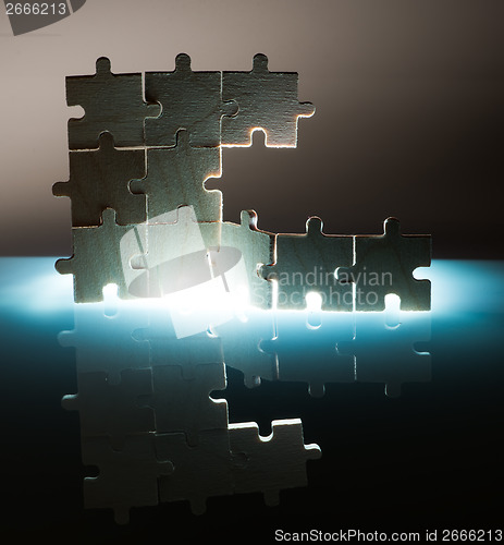 Image of Wooden puzzle and backlight background. Close up