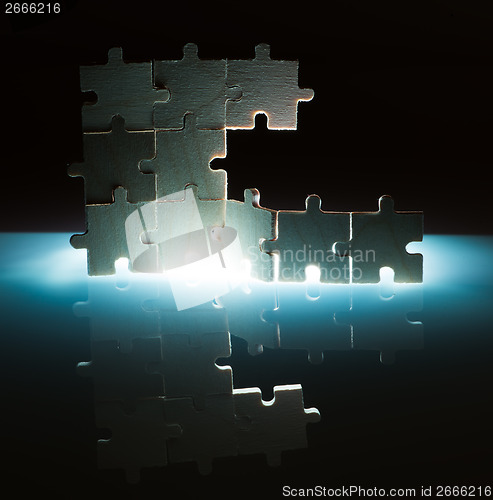 Image of Wooden puzzle and backlight background. Close up