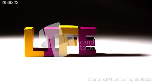 Image of Multicolored word life made of wood.