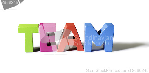 Image of Multicolored word team made of wood.