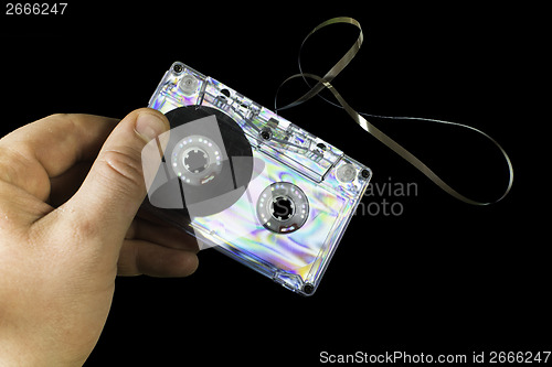 Image of Hand holding vintage cassette tape