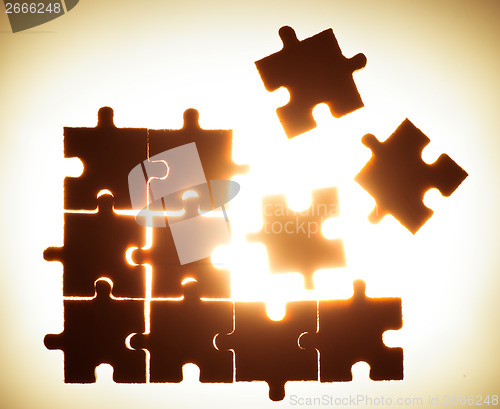 Image of Wooden puzzle and backlight background