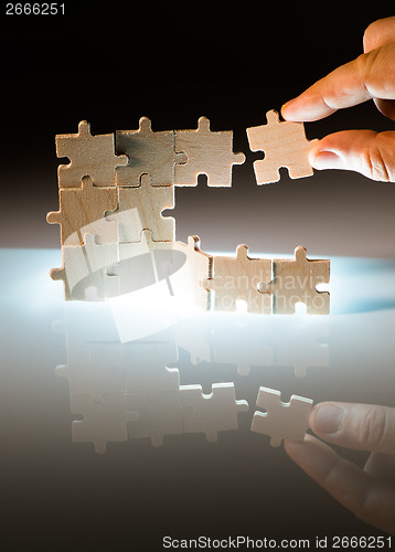 Image of Wooden puzzle and backlight background. Close up