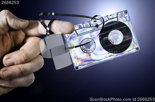 Image of Hand holding vintage cassette tape