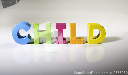 Image of Multicolored text child made of wood.