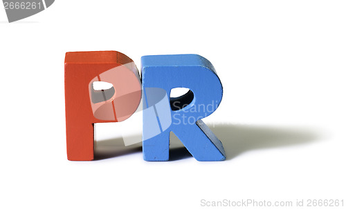 Image of Multicolored word PR made of wood.