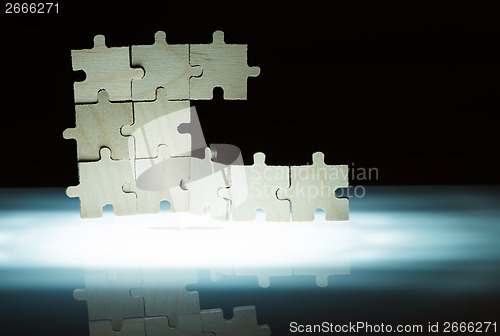 Image of Wooden puzzle and backlight background. Close up
