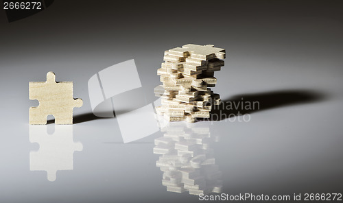 Image of Wooden puzzle on white background. 