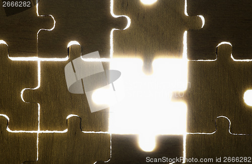 Image of Wooden puzzle and backlight background