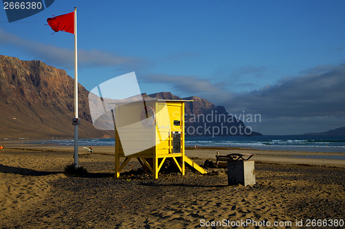 Image of lifeguard chair red flag in spain   pond  coastline and summer 